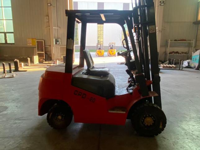 Four wheel electric forklift on a smooth warehouse floor for cold room duty